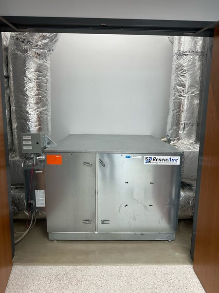 RenewAire energy recovery ventilator installed in a mechanical closet